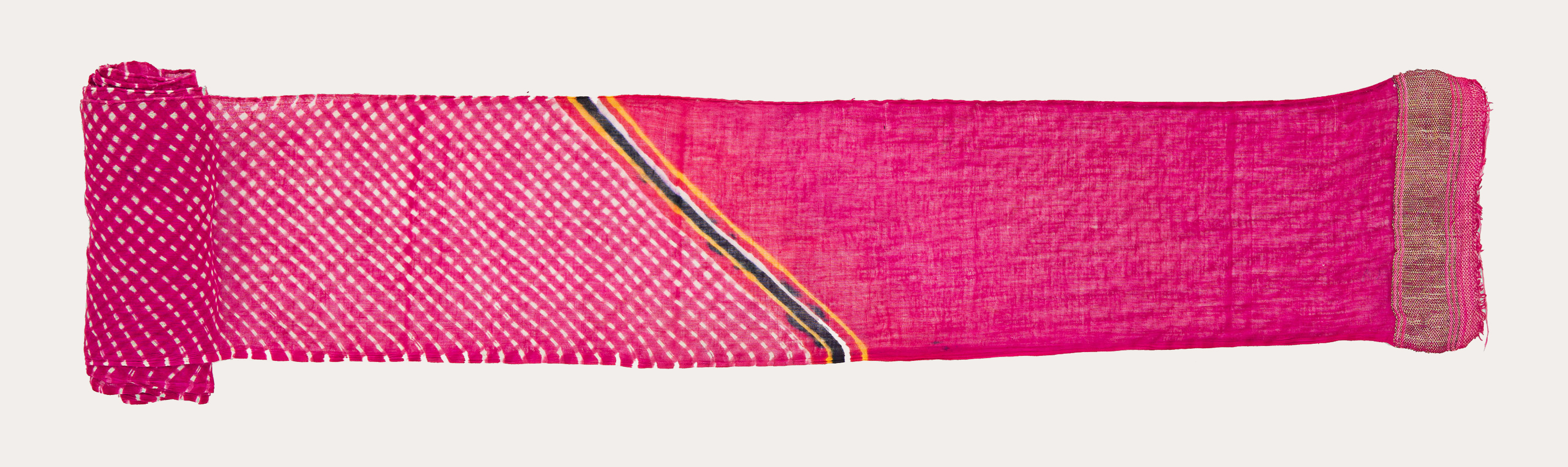 A long piece of rectangular cloth rolled from the right side. The left side is pink with a few bands of diagonal lines before a checkered pattern begins.
