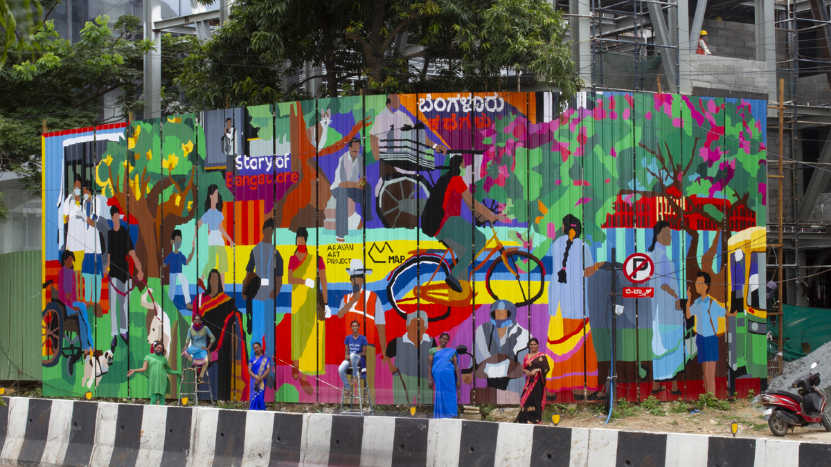 A mural by Aravani Art Collective outside the MAP construction site