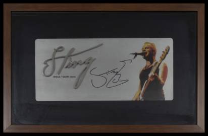 Sting turns slightly towards the left and sings into the mike. An embossed silver text with Sting’s name next to him.