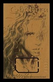 Shakira looks at us with her open hair flowing. The foreground text reads Shakira Live, Rs. 3650.